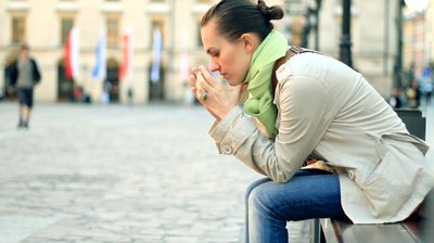 stock-footage-depressed-woman-sitting-in-urban-environment-camera-stabilizer-shot